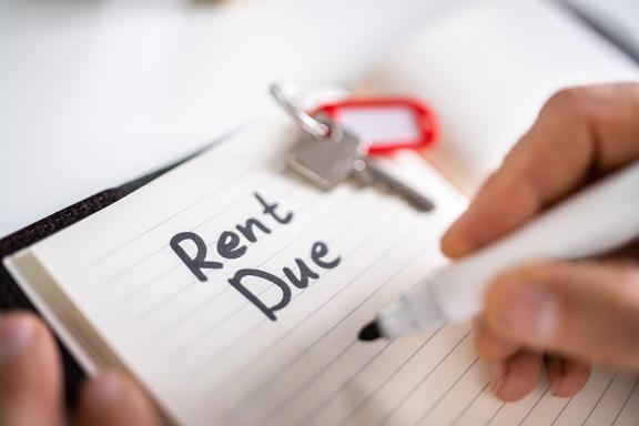 The words "Rent Due" written in a notebook